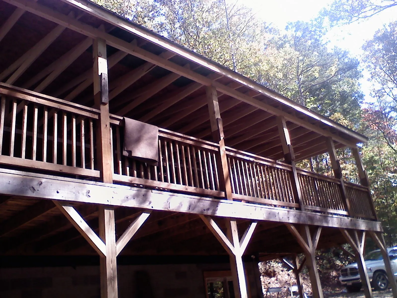 Timber framing under a new elevated porch and deck — Roof Leak Repair in Stockbridge by Roofing Brothers